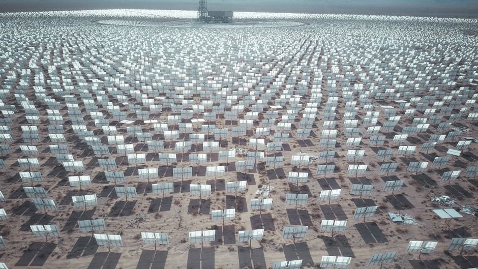 Aerial view of a VoltaCore battery storage park beside a solar field
